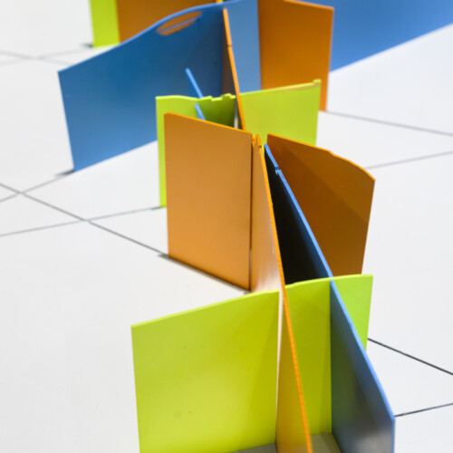 Detail of a 3D model made of colorful shapes on a white background.
