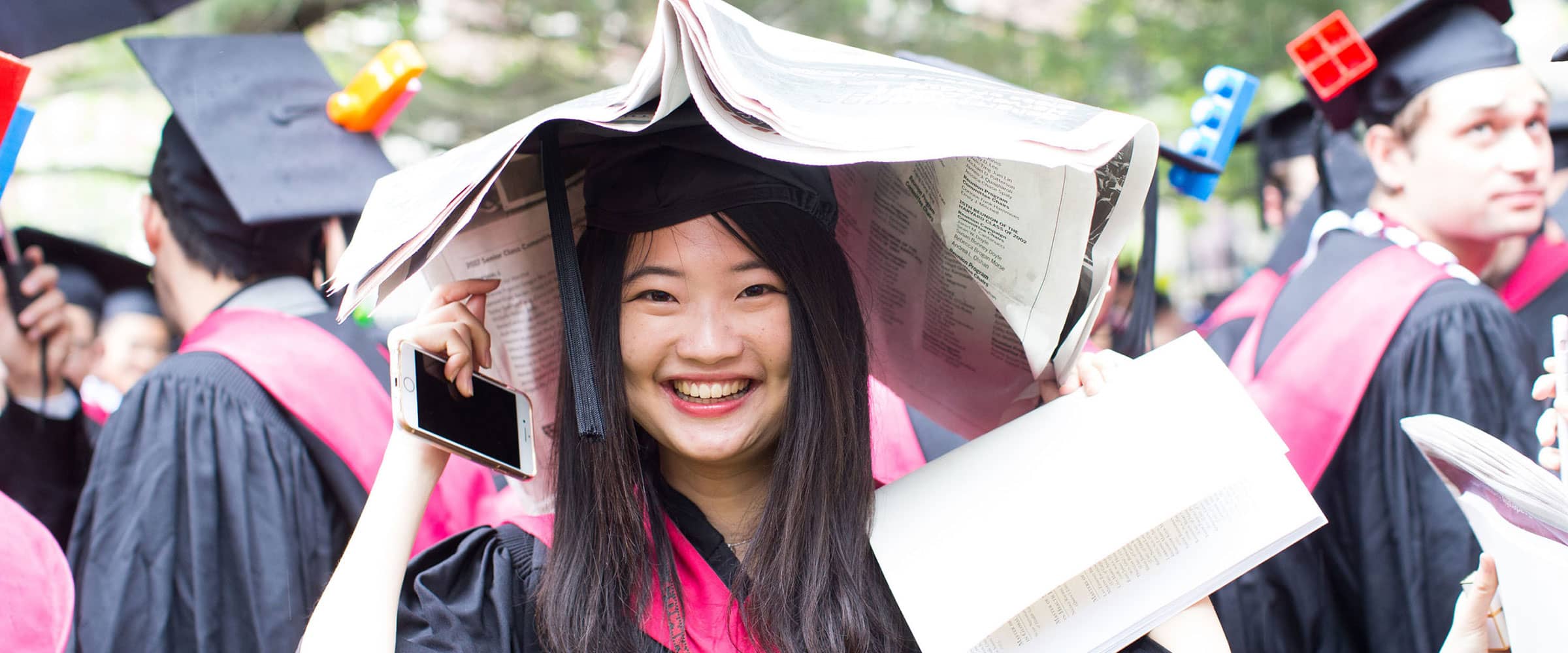 Students at commencement in graduation robes.