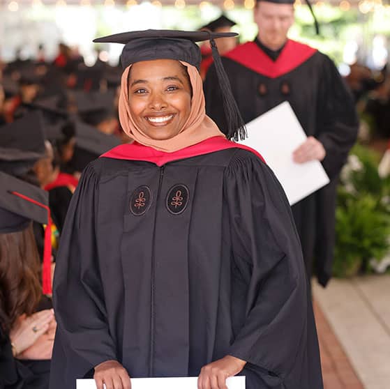 Student walking during commencement.