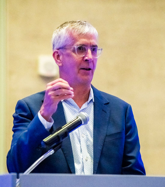 Image of Chris Herbert speaking at podium