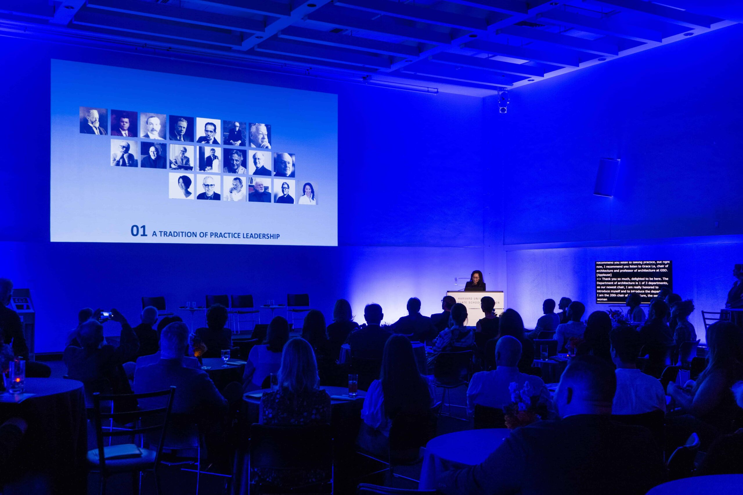 Grace La presents at a podium in Piper Auditorium