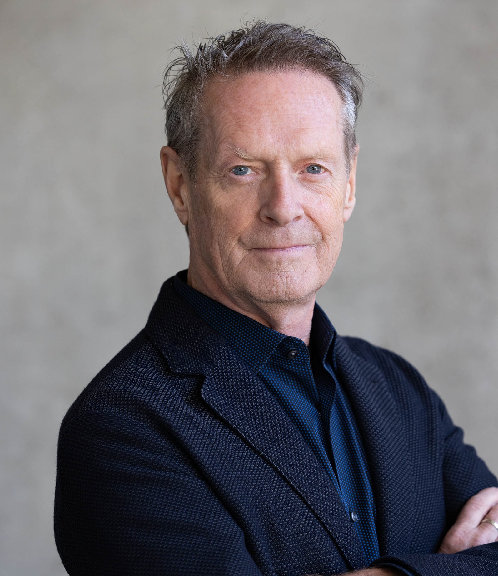 Headshot of Gary Hilderbrand with his arms crossed.