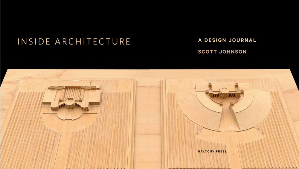 Black interior book spread with wooden model.