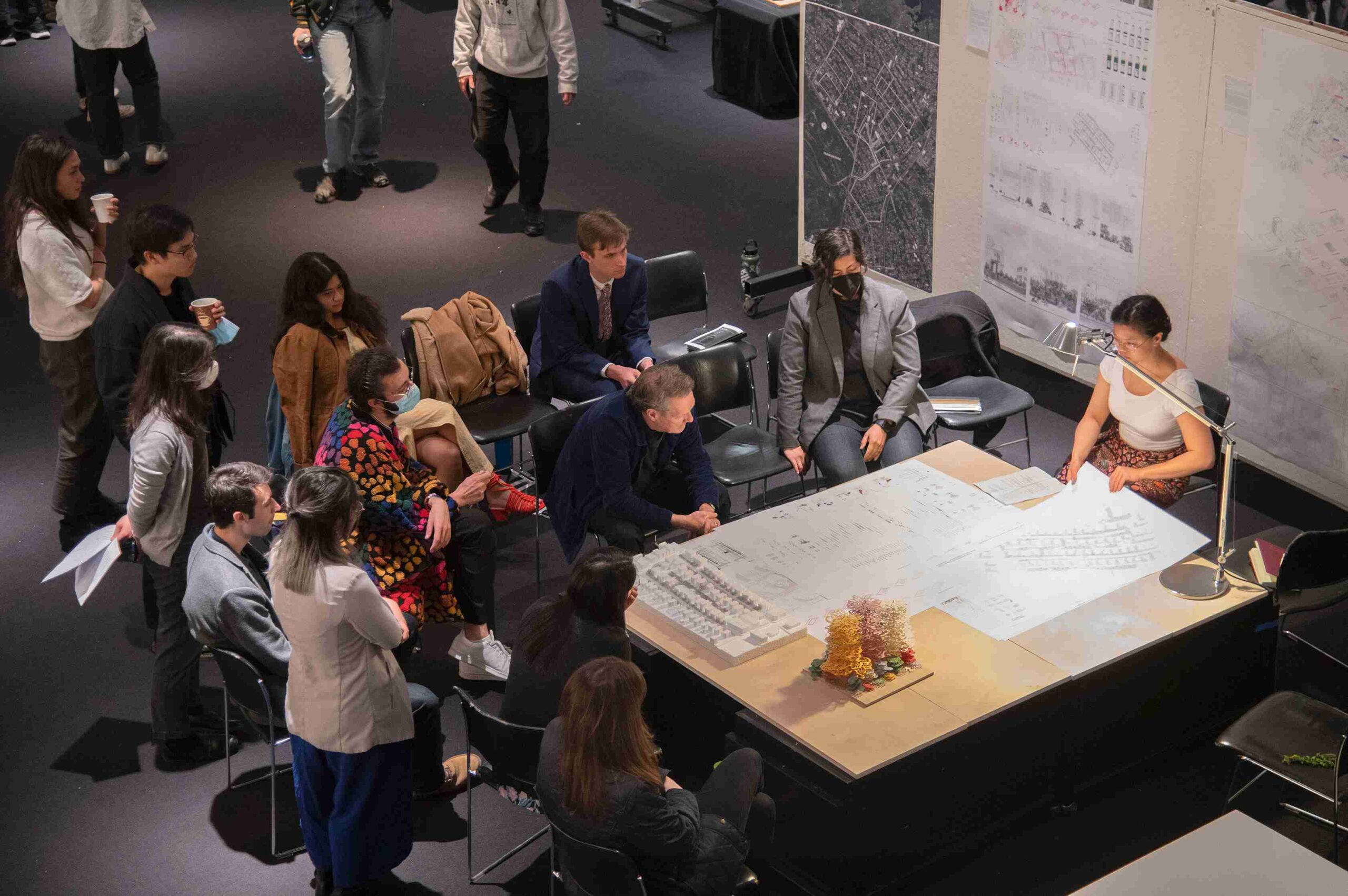 Group of people around a table during an exhibition.
