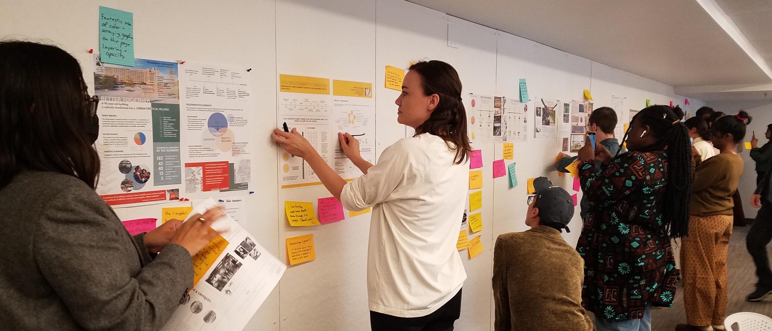 MUP students reviewing coursework in a workshop