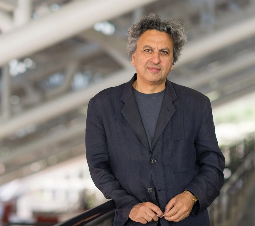 Headshot of Mohsen Mostafavi standing in the Harvard GSD student trays.
