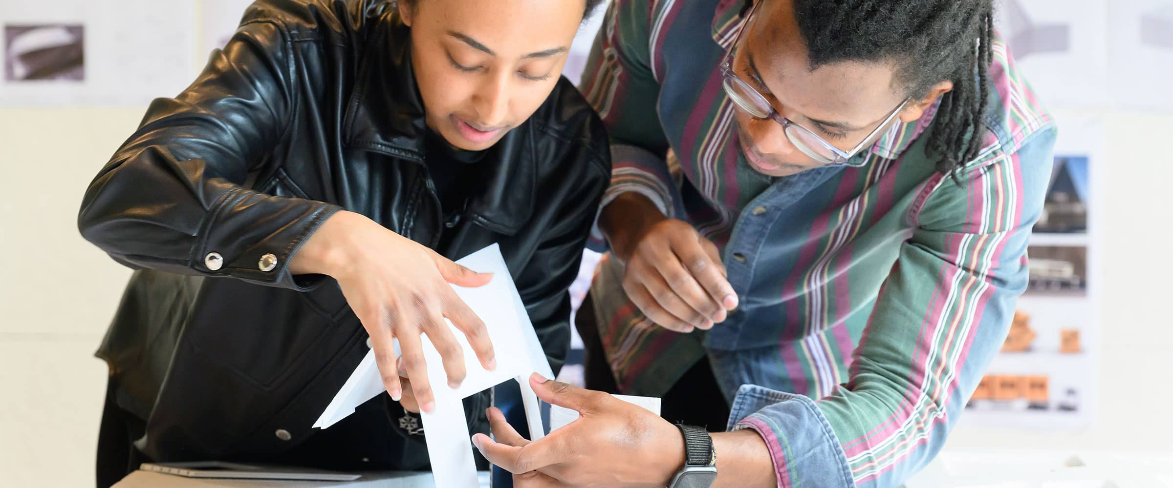 Students work together constructing a model.