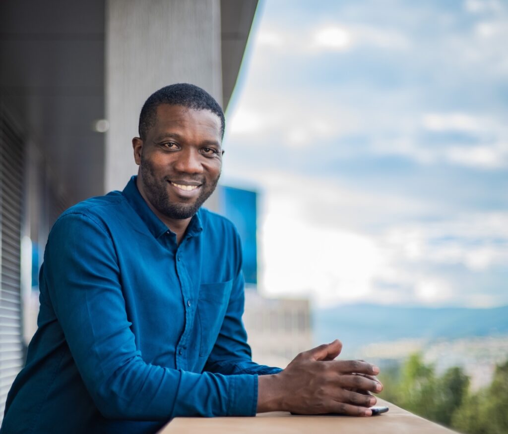 Outdoor headshot of Christian Benimana.