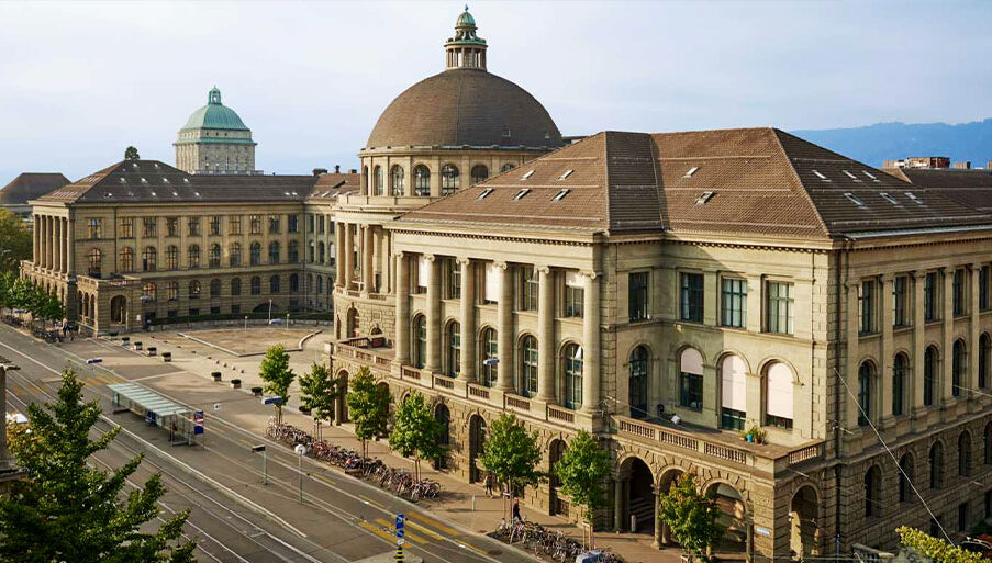 Historic main building of ETH Zurich campus on a sunny day.