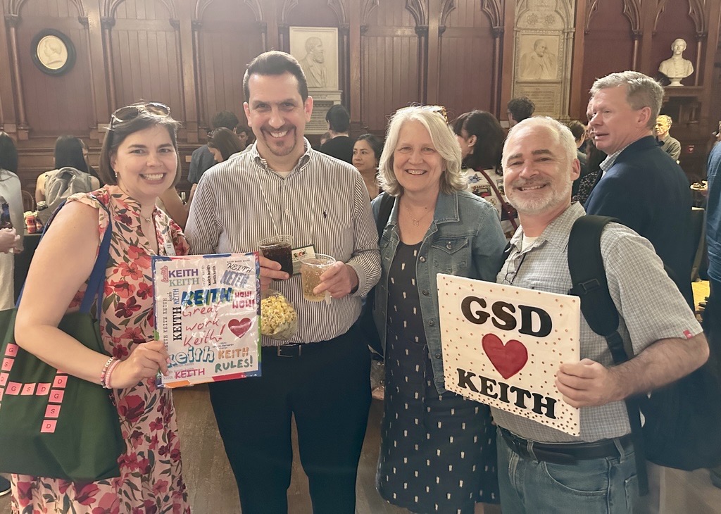 The 2025 winner of the GSD's Dean's Award stands with three other staff members at the Harvard Hero event.