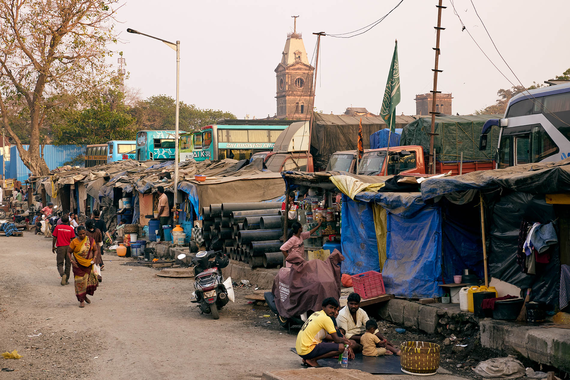 Informal settlement with an old clock tower in the background in Mumbai