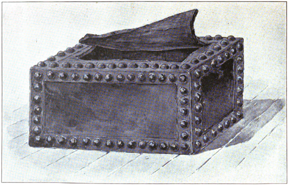 Image of an old leather and brass bound box.