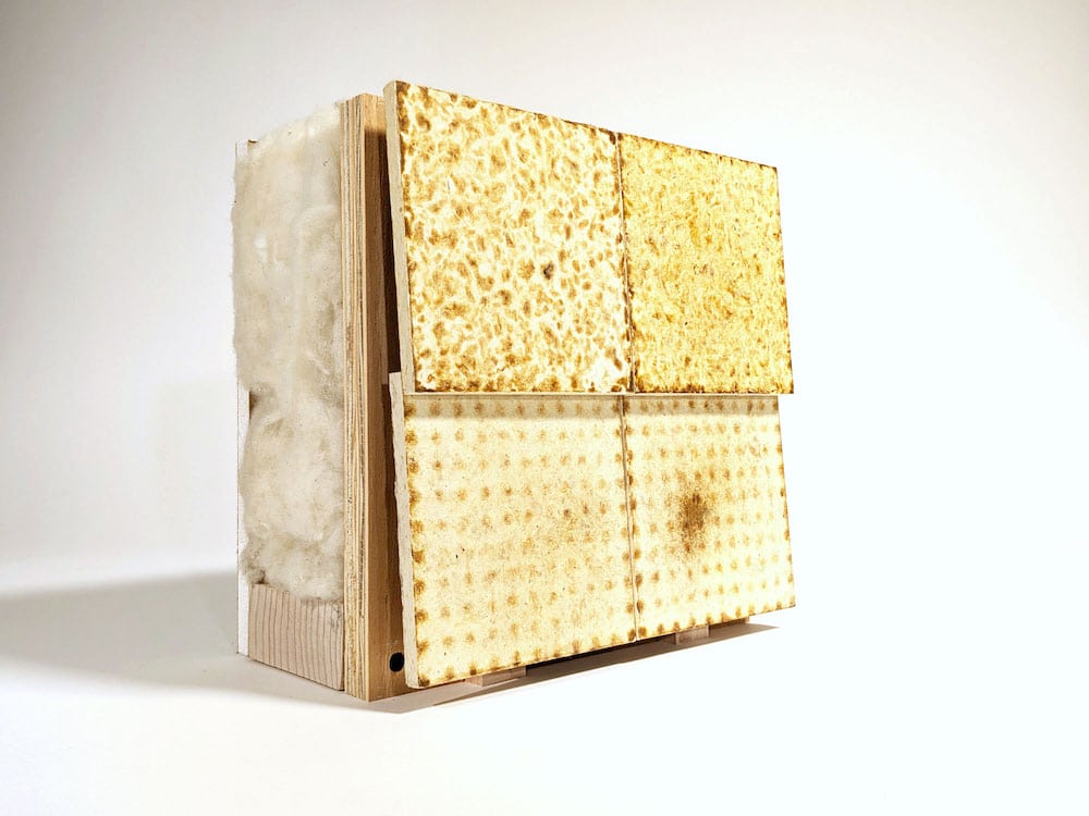 Four panels of an upcycled wool bio-composite in a two-by-two grid.