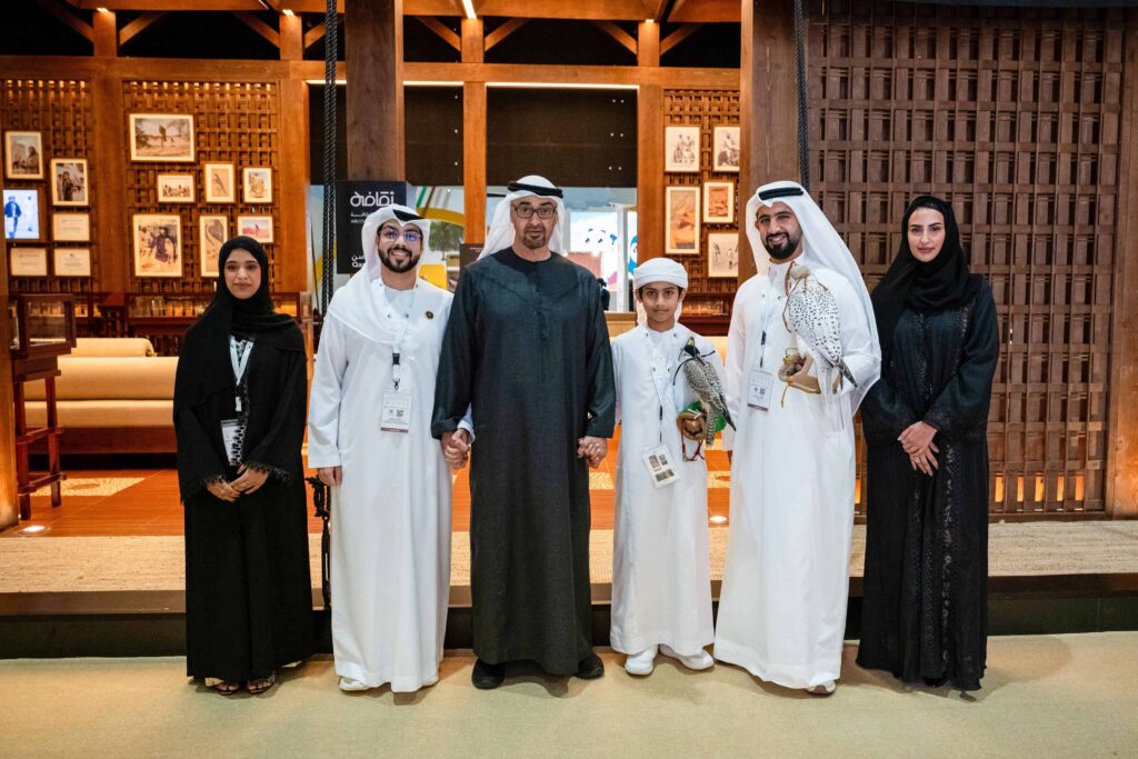 Group photo pose with falcon at Oorvia Sharma's exhibiton