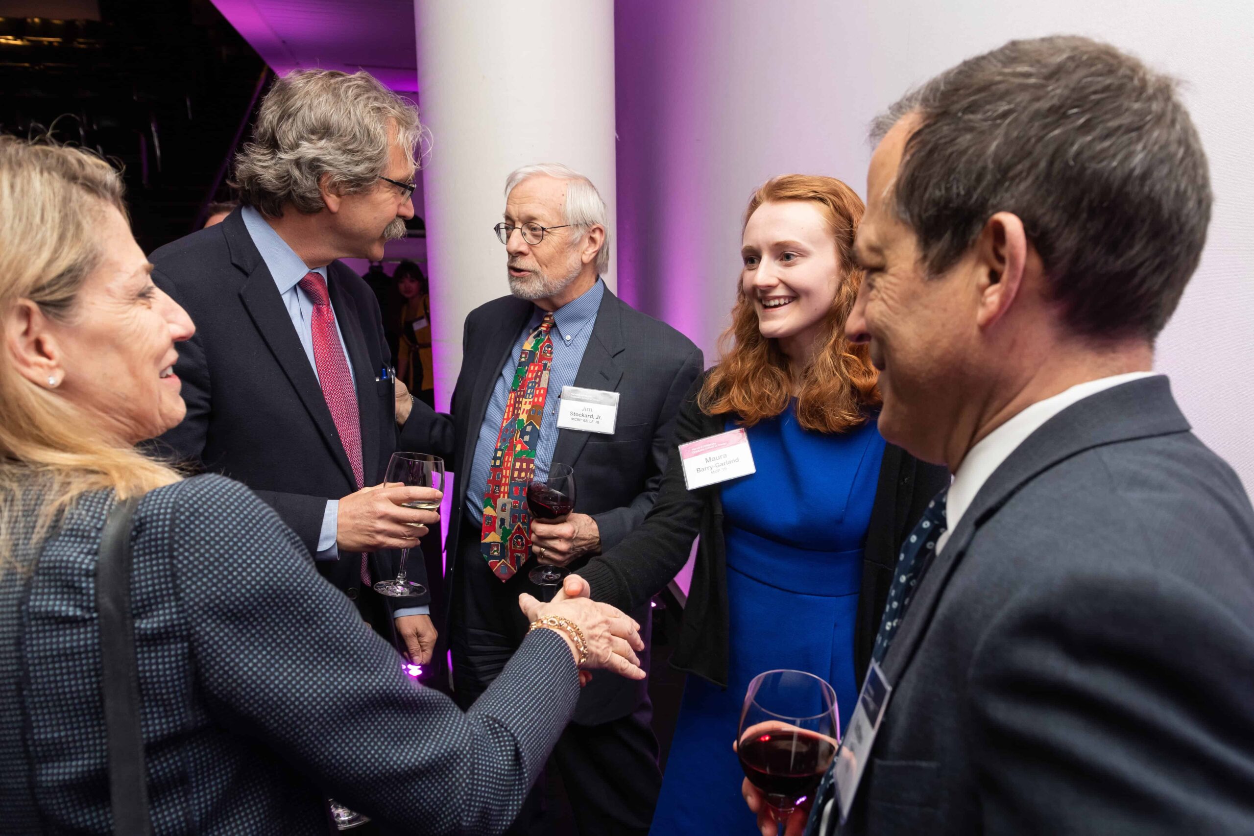 Five people gather in a circle and make introductions at the Fellowship Event 2019, including James Stockard