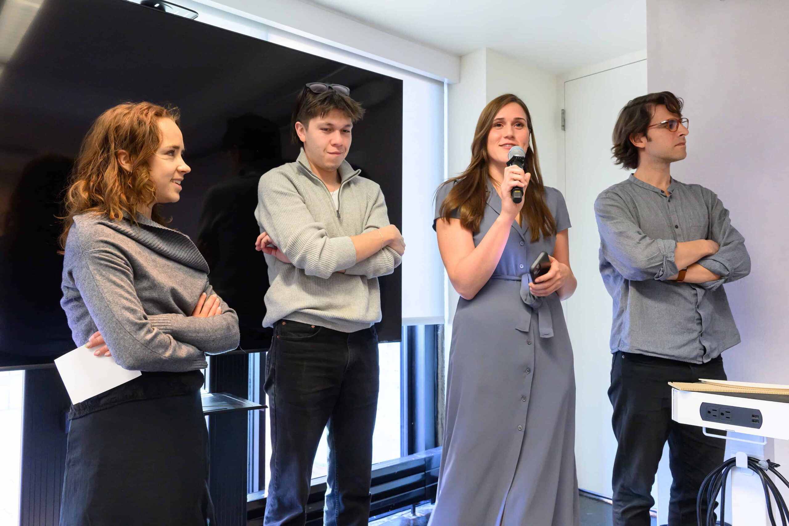 Four students stand and present during Plimpton Poorvu Design Prize event