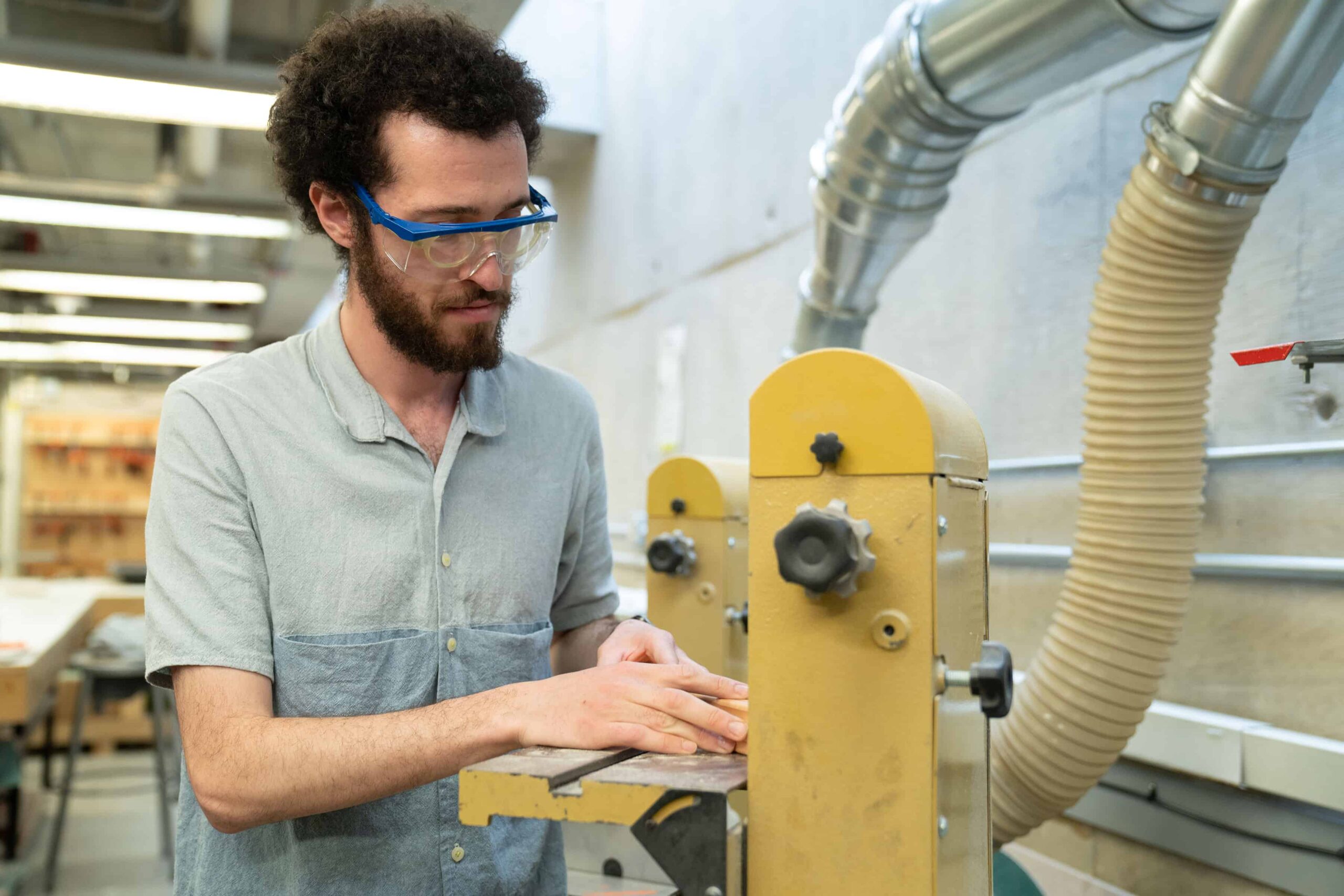 a student uses equipment in the Fabrication Lab