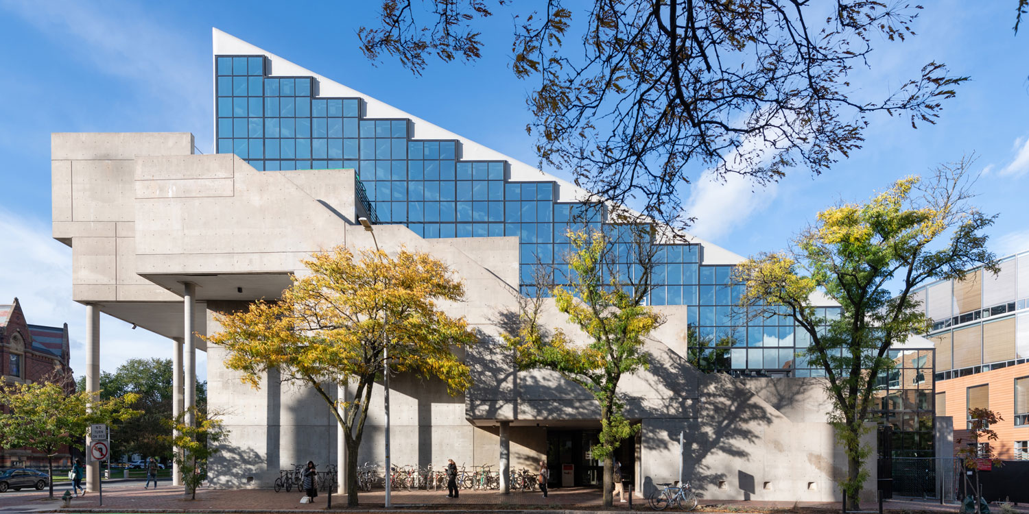 Concrete and glass building with trees.