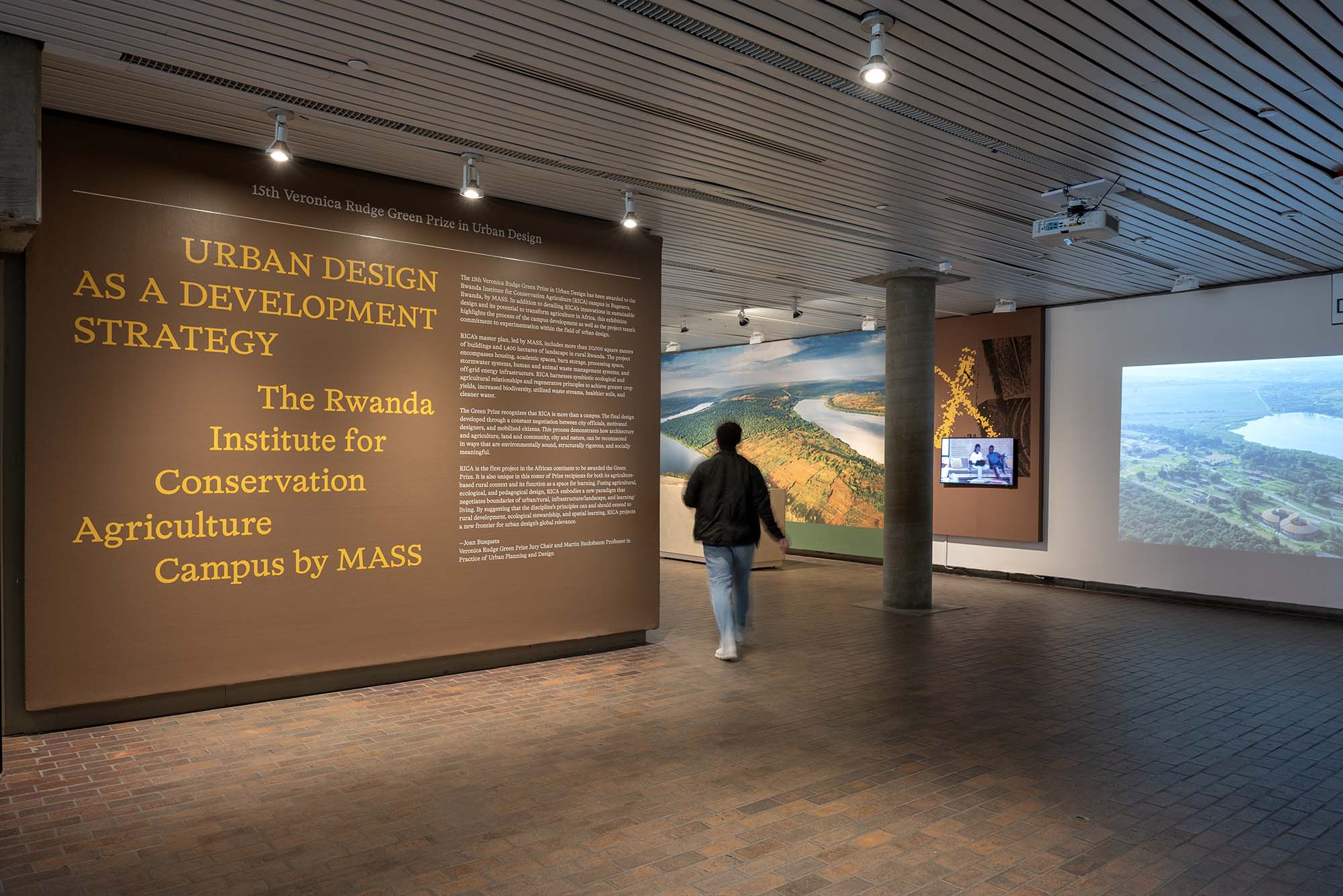 A person walks through an exhibition.