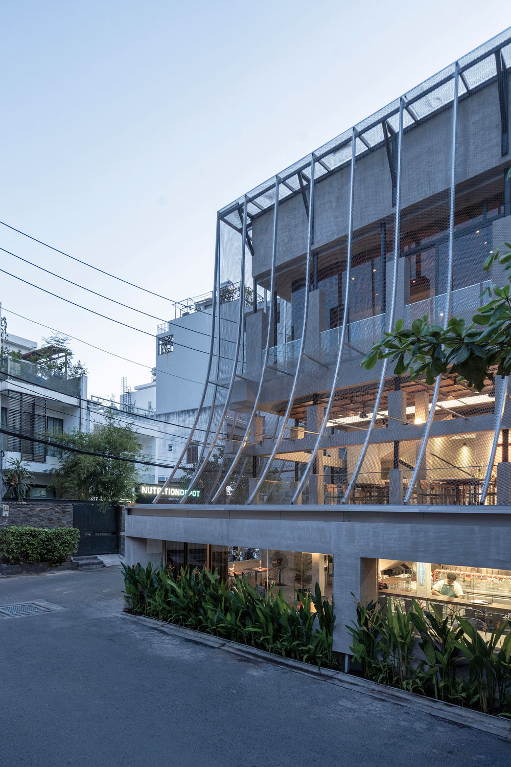 View of concrete building with mesh screen over it