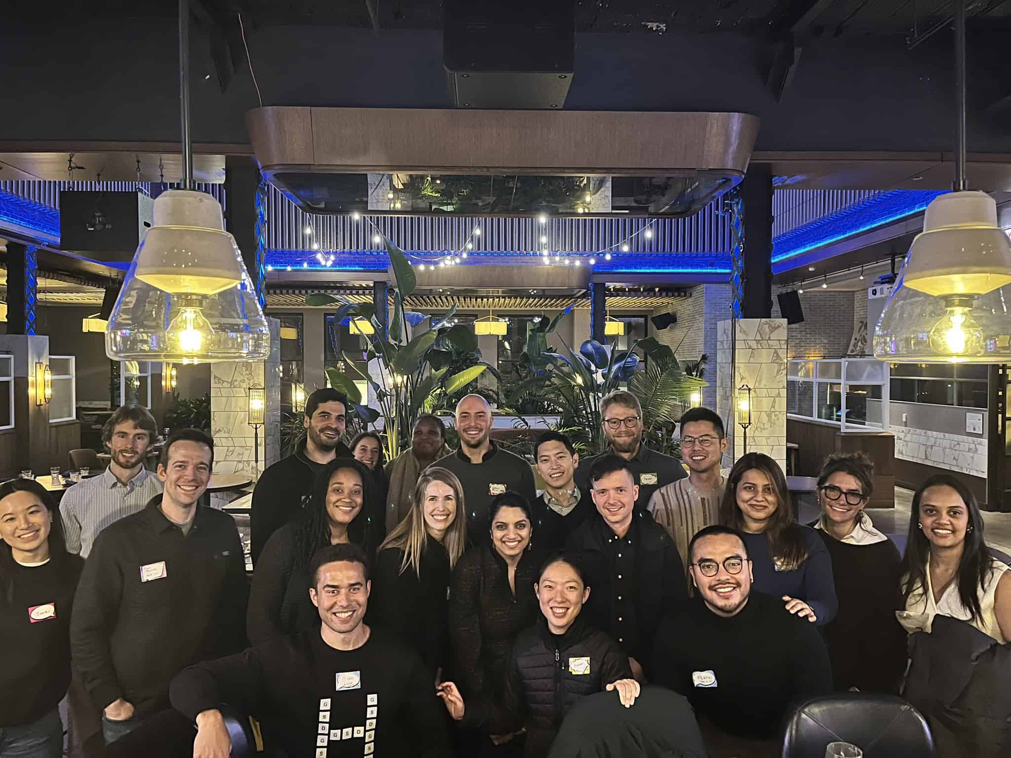 GSD alumni and students dressed in black smile