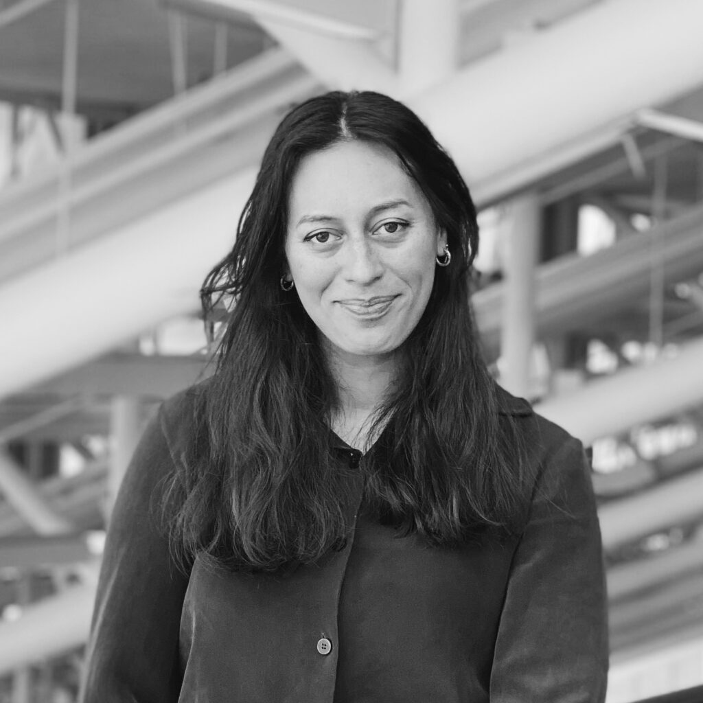 Elyjana Roach black and white headshot in the trays