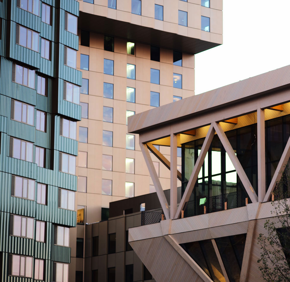 Green, yellowish, and wood building overlapping
