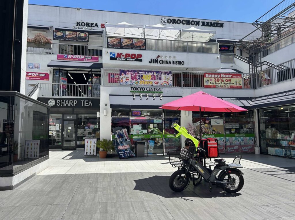 Electric delivery bike in shopping center courtyard