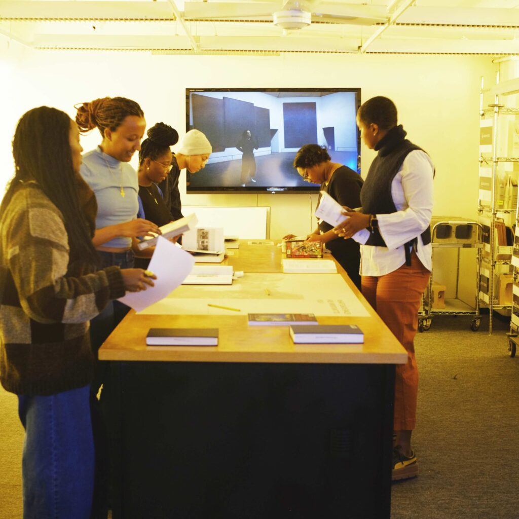 students look at materials in the archives