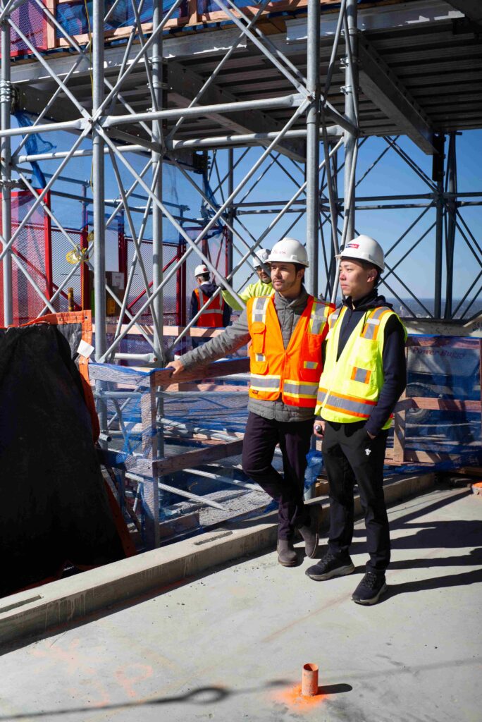 Two men workers on South Station Tower