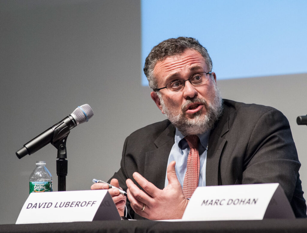 Man speaking at microphone
