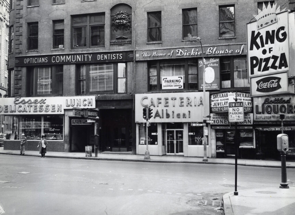 Black and white urban street scene from 1960s Boston
