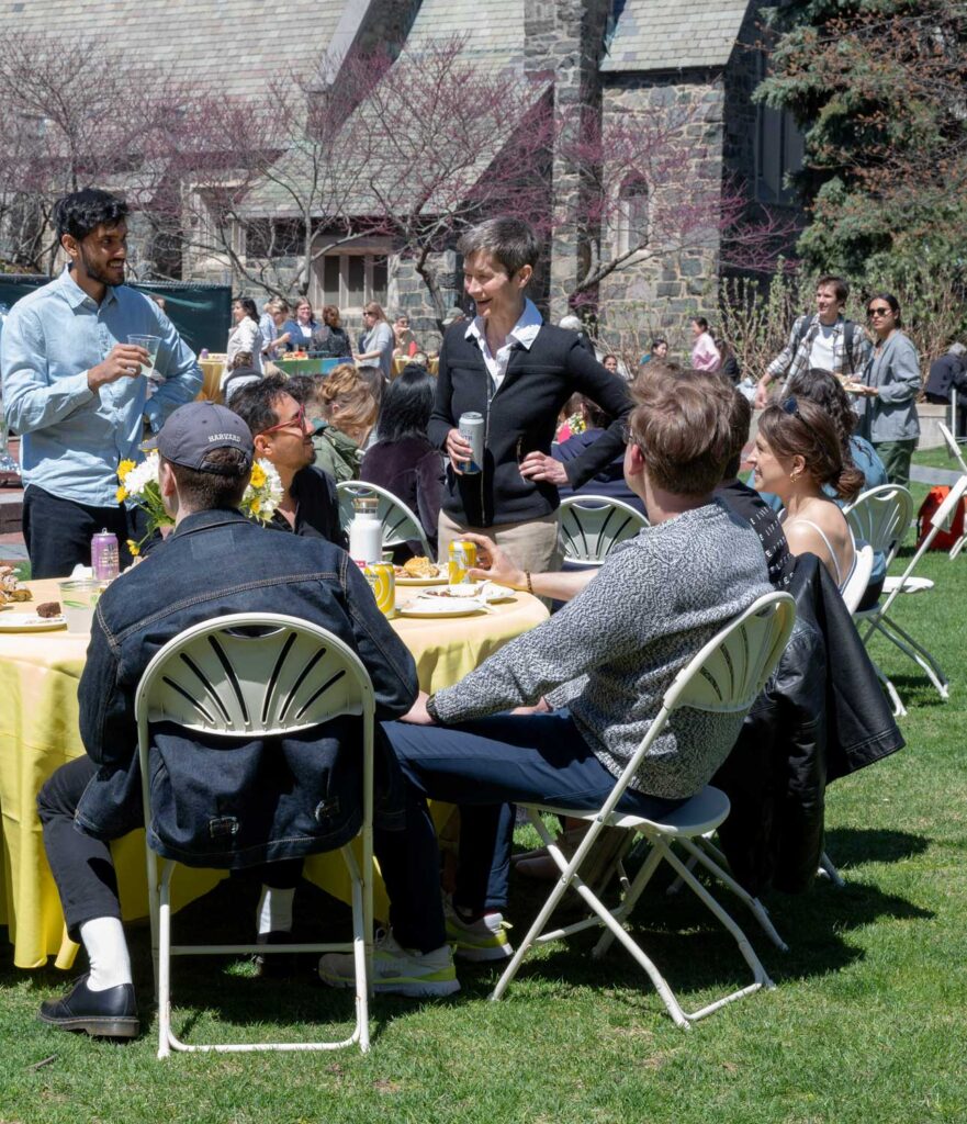 Group of people talking outside.