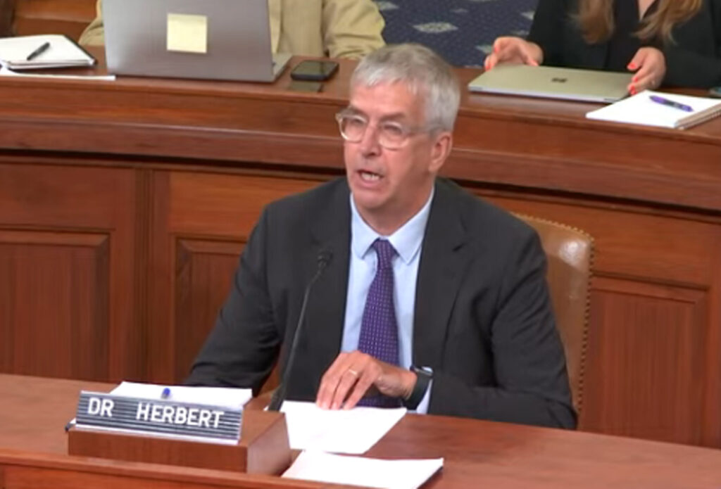 Man in suit in Senate.