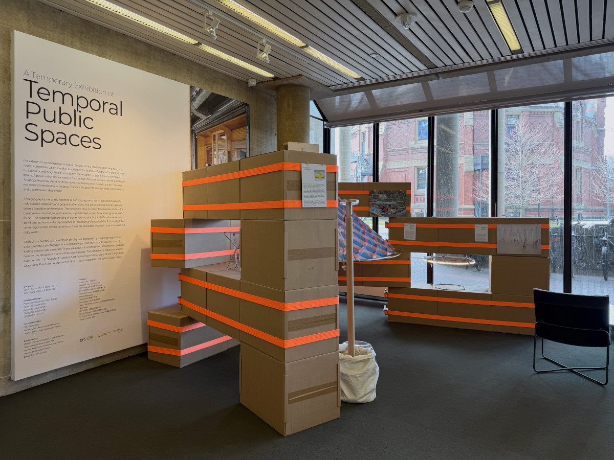 A temporary structure built from cardboard boxes and ratchet straps in Frances Loeb Library.