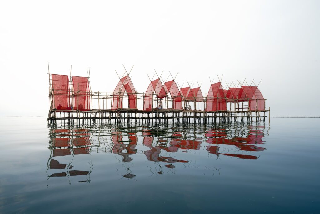 Photo of floating structure with red fabric.