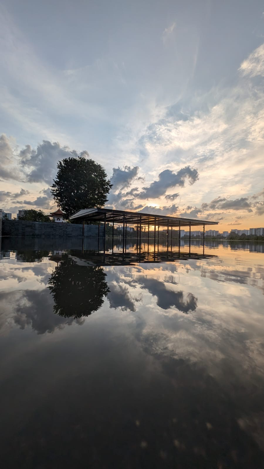 A small pavilion that appears to be floating in a lake. Jurong Lake Gardens by Salad Dressing.