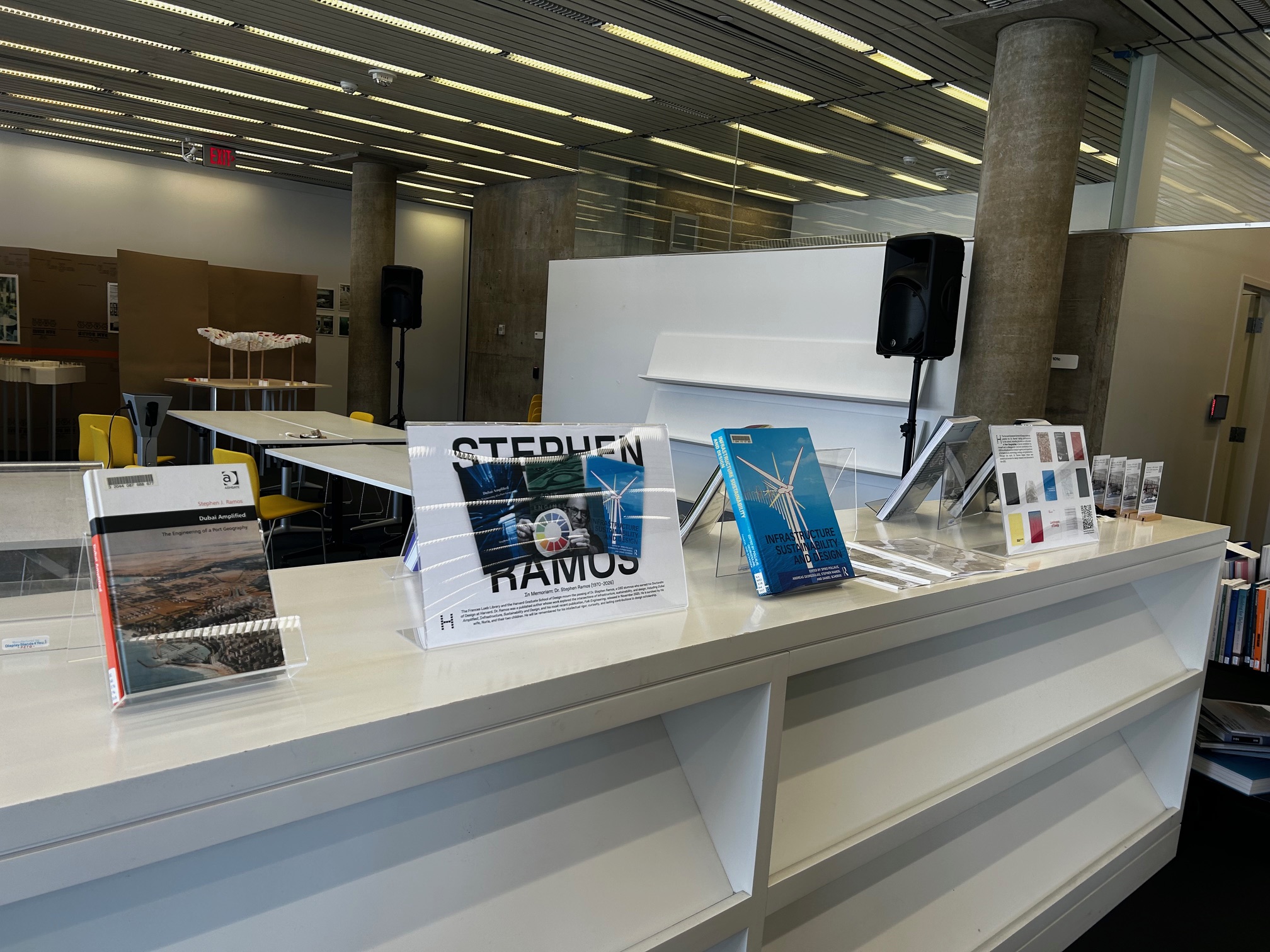 A collection of books on a white shelf