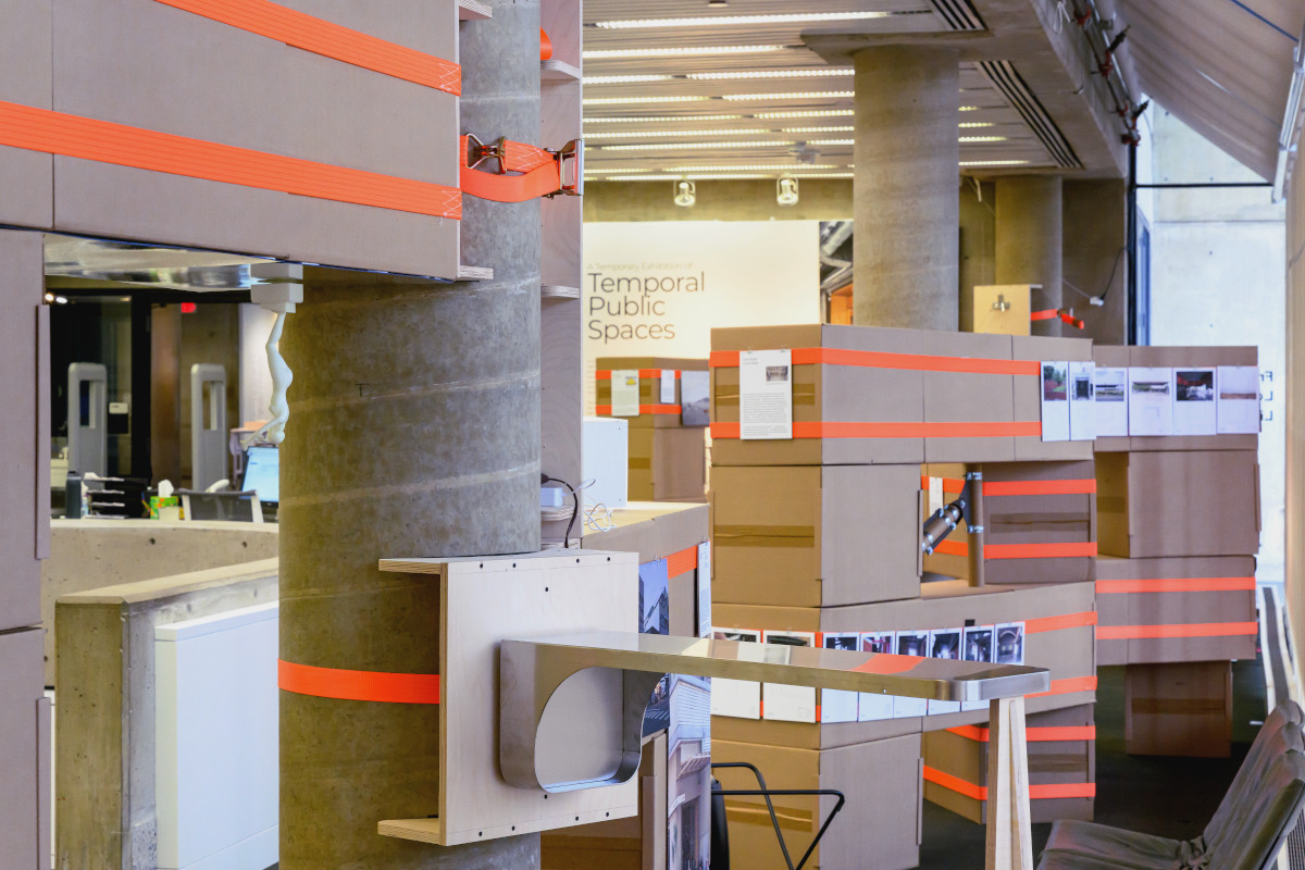 A temporary structure built from cardboard boxes and ratchet straps in Frances Loeb Library.