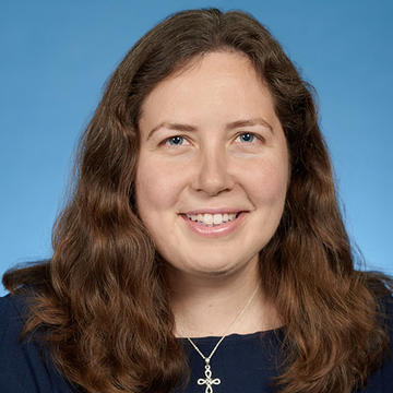 Kenzie Bok headshot on blue background