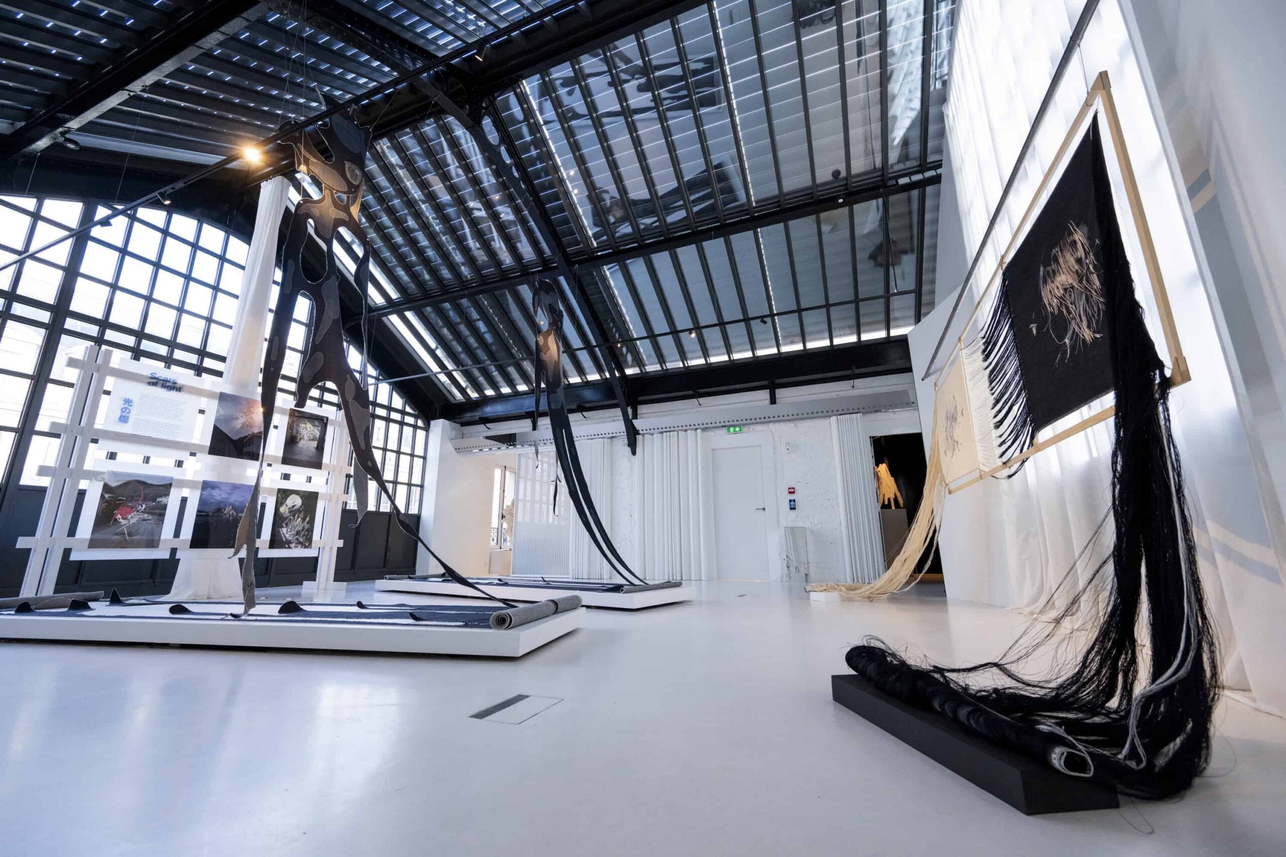 Textile artworks in a bright minimalist gallery