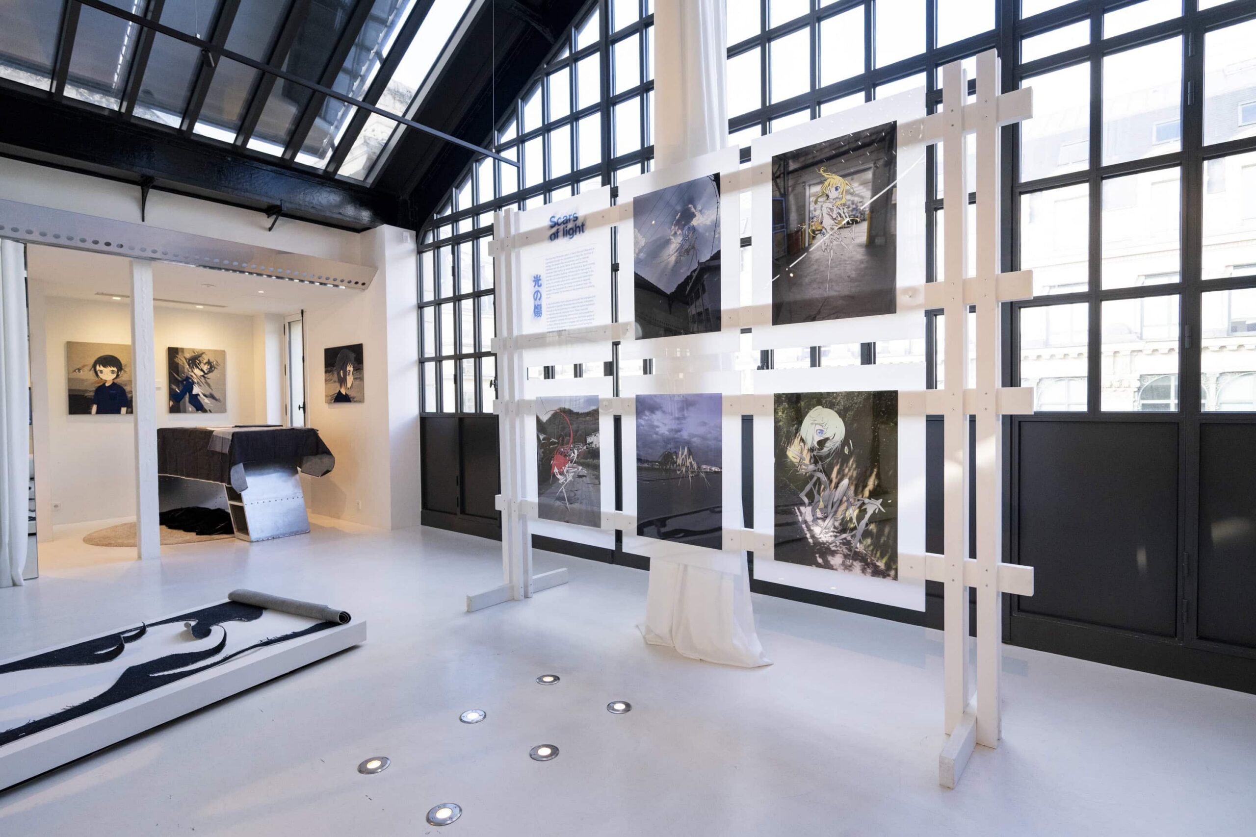 A bright white minimalist gallery with artwork