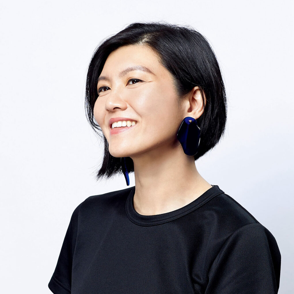 Woman wearing black and smiling