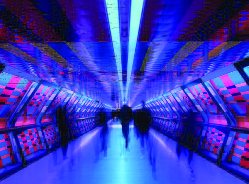 A pedestrian tunnel in a transit system illuminated with neon lights.