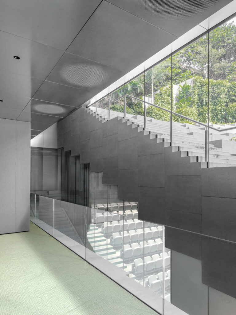 View showing garden, stairway, and auditorium tucked beneath stair.