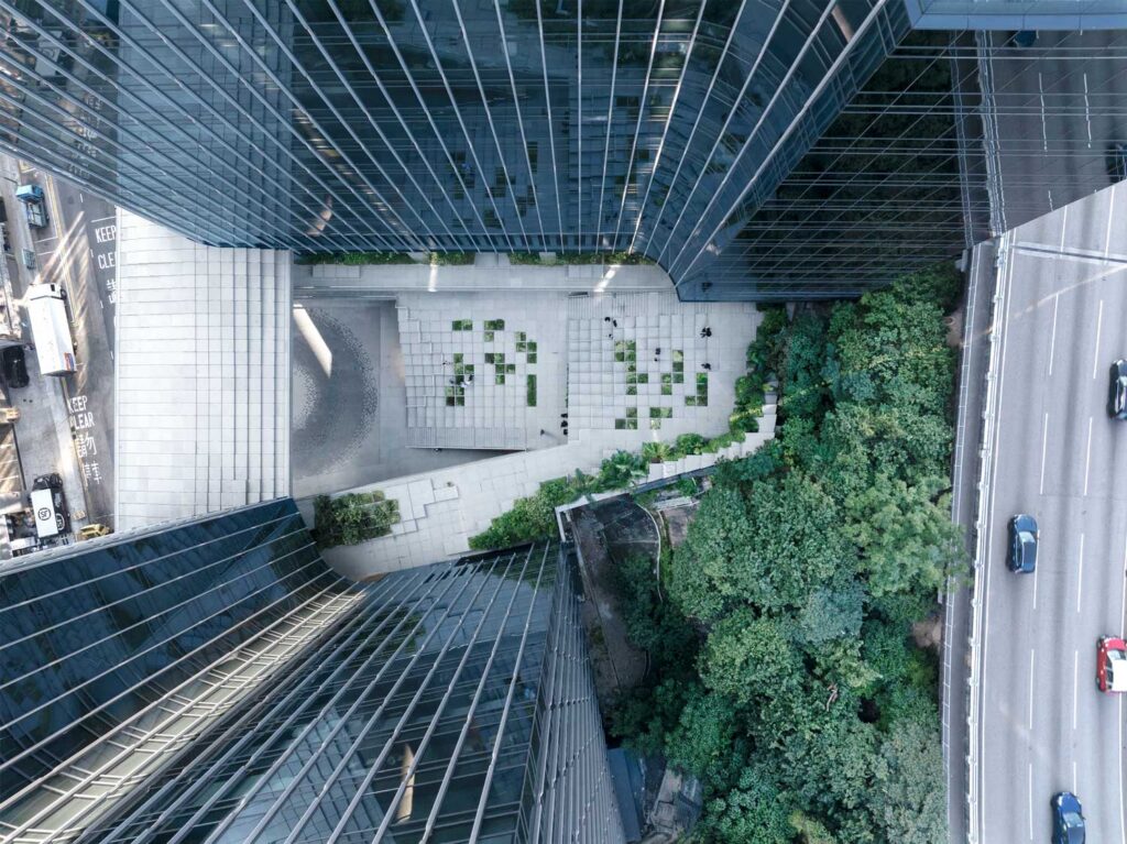 Aerial view of two towers with a steeped base between them.