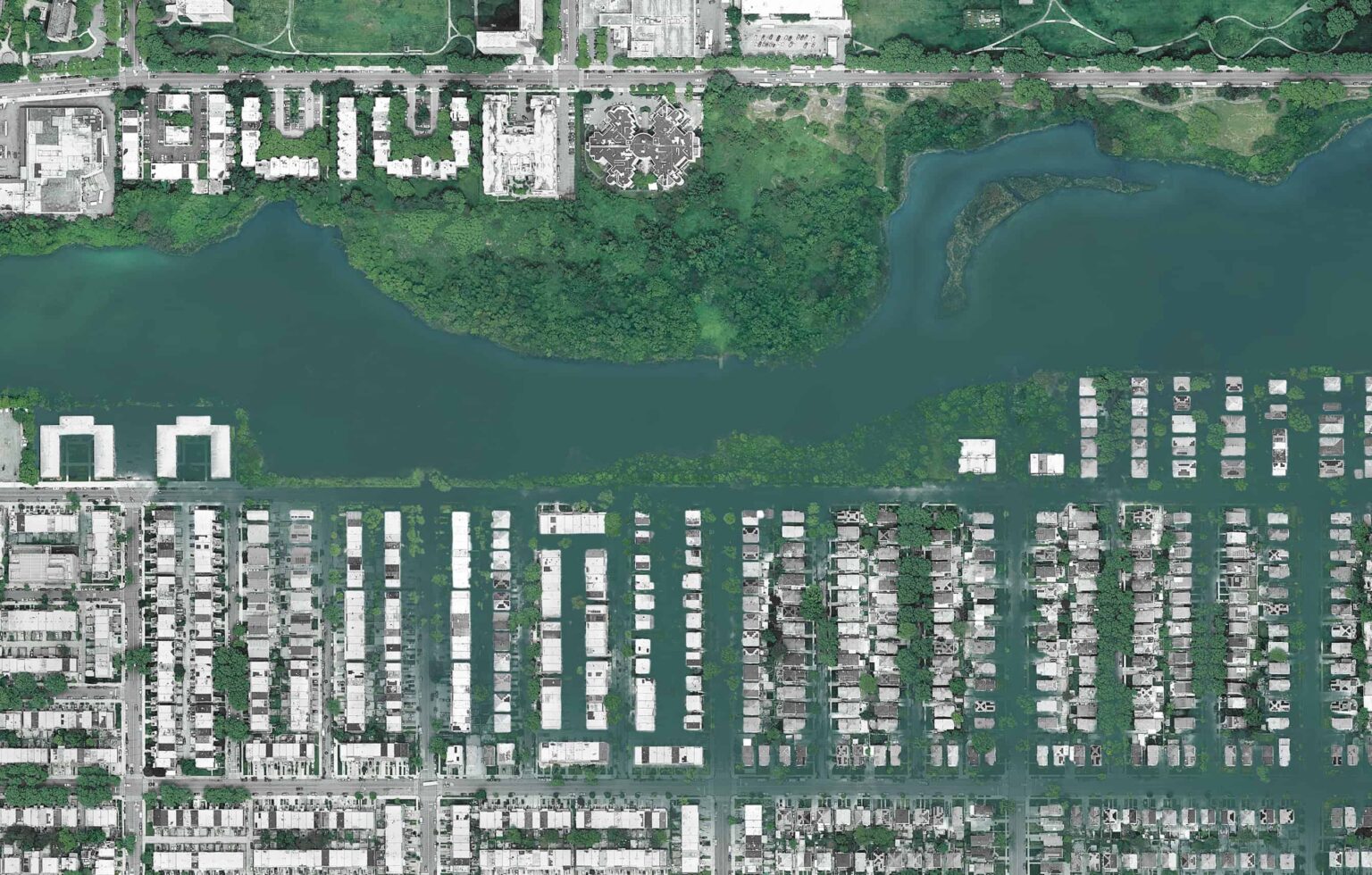 This is an aerial or satellite-style view of an urban area bordering a body of water.