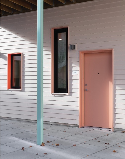 View of pink door and light blue column.