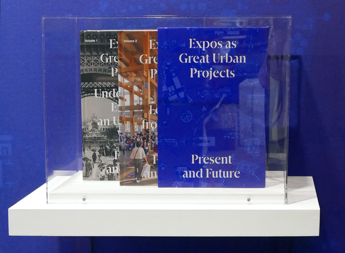 A shelf displaying a set of books titled "Expos as Great Urban Projects - Present and Future."