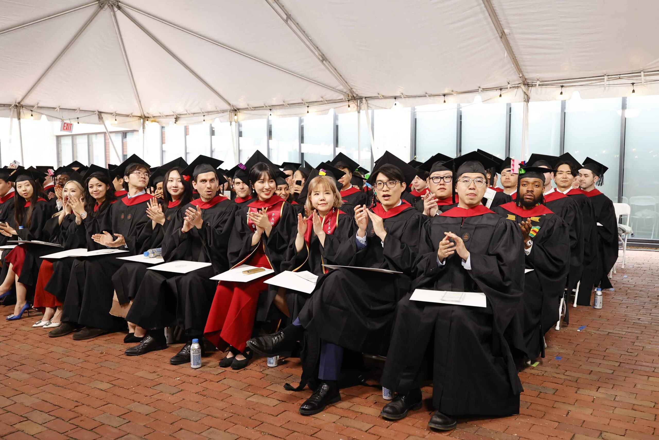 Soon to be graduates sitting in Commencment attire.
